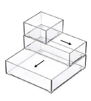 Das BNB x VCN Schubladen-Organizer-Set SLIDE (5-teilig) besteht aus fünf unterschiedlich großen, transparenten Acrylboxen, die stufenförmig übereinander gestapelt sind und durch schwarze Pfeile die Möglichkeit bieten, sie nach außen zu schieben - ideal für eine flexible Schubladenordnung.