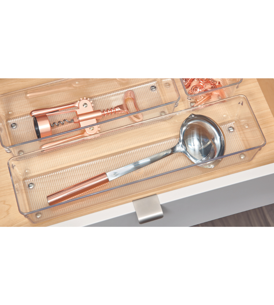 The LINUS - HIGH drawer organizer from iDesign holds a metal trowel with a copper handle and corkscrew; copper clips are stored in a small compartment, keeping your kitchen drawer tidy.